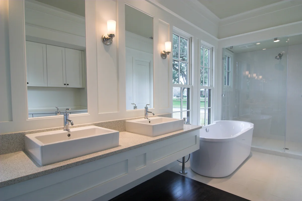 Newly remodeled white contemporary bathroom in winter park florida built by a bathroom remodeler