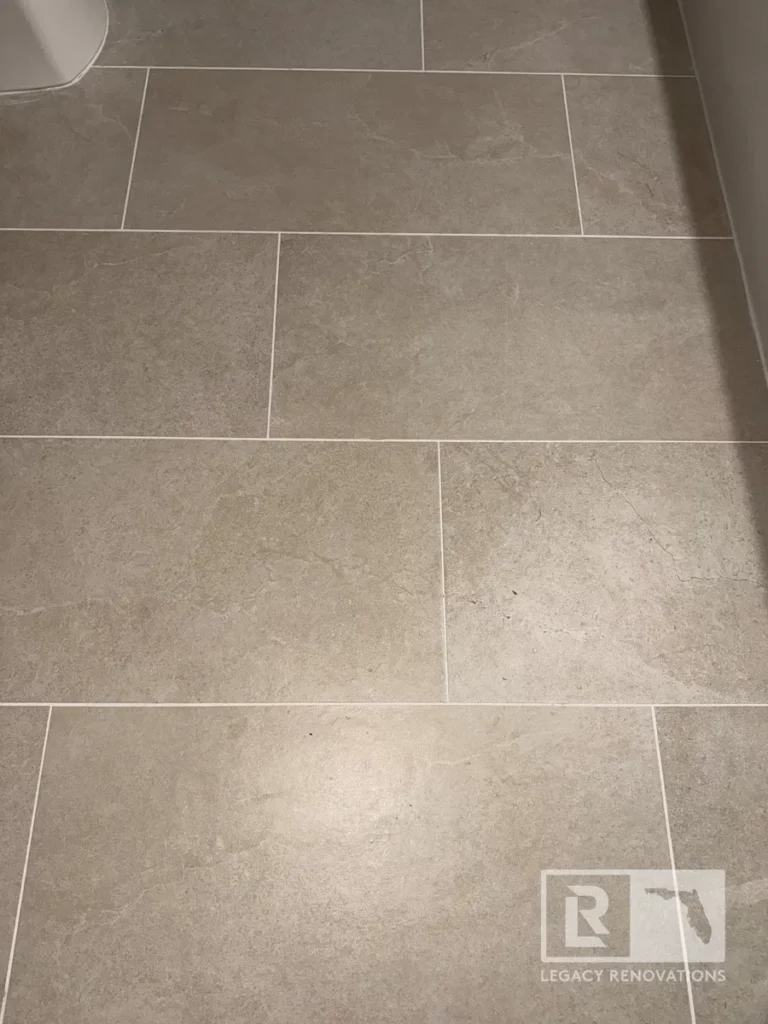 Gray stone-look floor tiles arranged in a staggered pattern in San Jose neighborhood, Jacksonville, FL