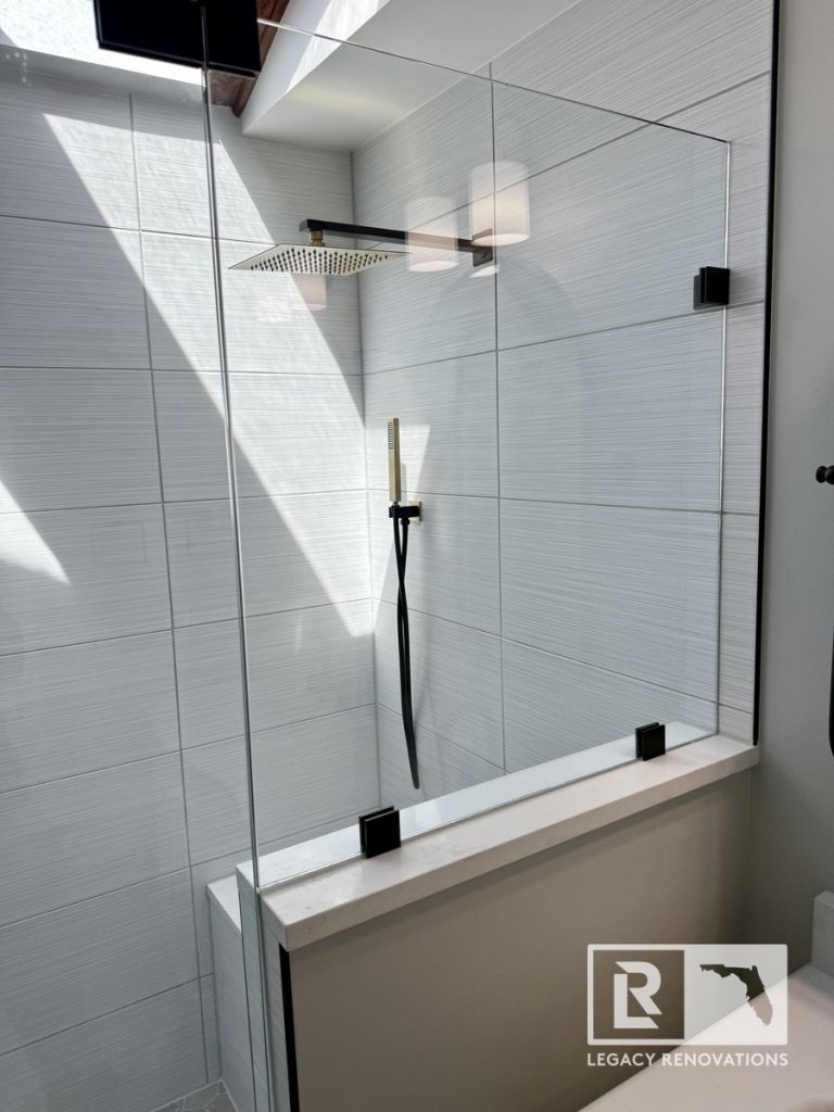 Custom tiled walk-in shower with matte black fixtures in Jacksonville, Florida, Legacy Renovations
